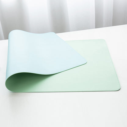 a white table with a light green place mat