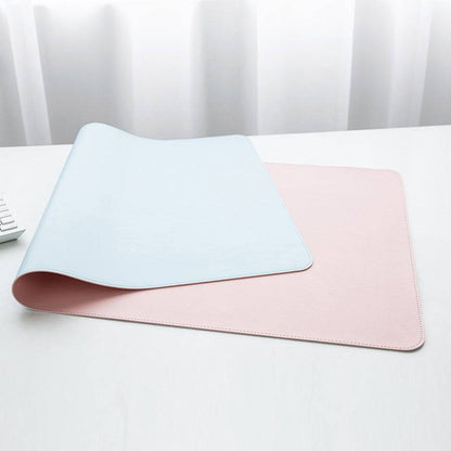 a pair of pink and blue placemats next to a remote control