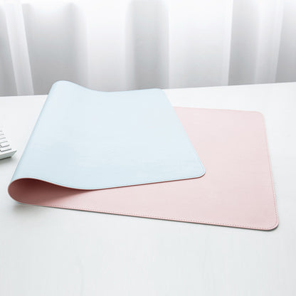 a pair of pink and blue placemats on a white table