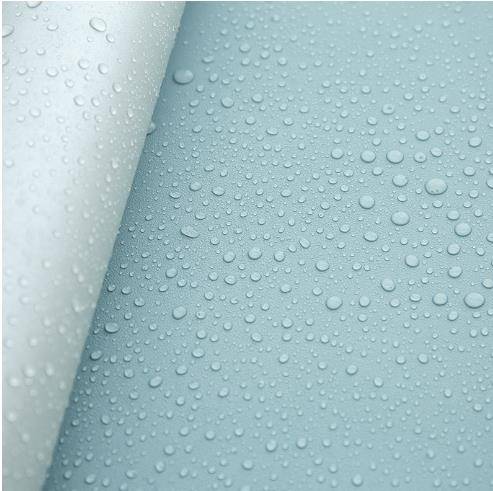 a close up of water droplets on a blue surface